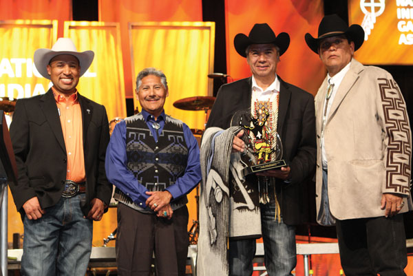 Ray Champ; Mark Chino, Chairman Tex Hall of the Mandan, Hidatsa & Arikara Nation; and Chairman Ernie Stevens Jr. at the Wendell Chino Humanitarian Awards Banquet.